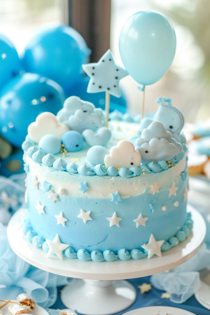 a blue cake with white stars on it and some balloons in the air behind it