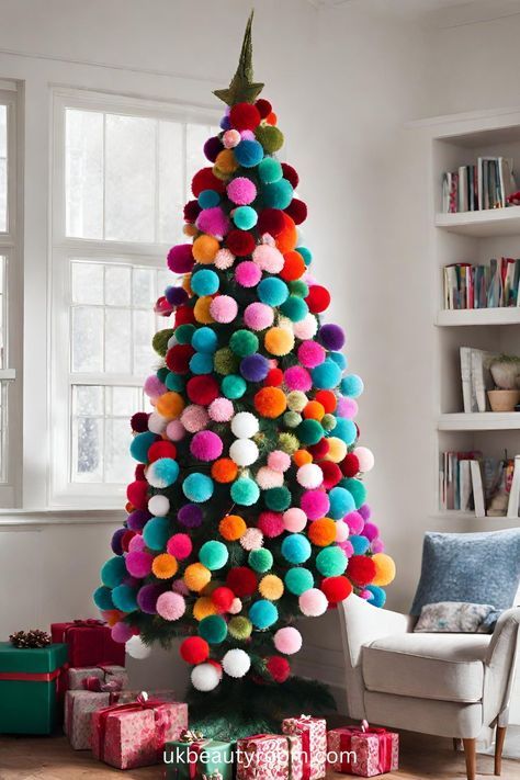 a brightly colored christmas tree with pom - poms