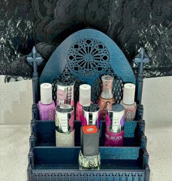 Elevate your vanity with this stunning Gothic Cathedral Nail Polish Organizer, a perfect blend of elegance and functionality. Inspired by the intricate architecture of classic Gothic cathedrals, this organizer is designed to hold your nail polishes, makeup, or other beauty essentials with style. Key Features: Unique Design: A detailed, Gothic cathedral-inspired design adds a touch of sophistication and mystery to your beauty routine. Customizable Colors: Choose from a variety of colors to match your personal style or decor. Spacious Storage: Designed with multiple slots to neatly store your nail polish bottles or other makeup items. High-Quality 3D Print: Crafted using durable, high-quality materials to ensure long-lasting use. Dimensions: 5 x 7 x 7 inches, offering ample space without tak Unique Vanity, Intricate Architecture, Xmas Wishlist, Nail Polish Organizer, Gothic Cathedrals, Gothic Cathedral, Makeup Holder, Nail Polish Bottles, Vanity Decor