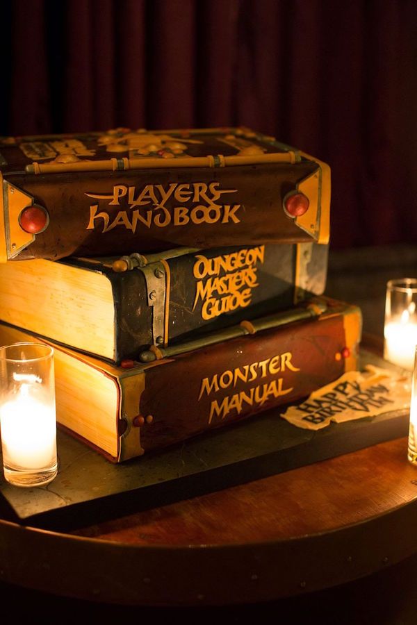 three books stacked on top of each other with candles