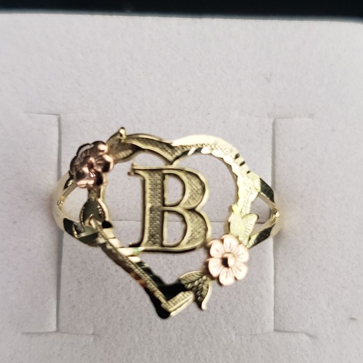 10kt Gold Initial Ring Weight 1.60gms Width 13.5mm Front And 2.0 Mm Back Size 8.5 No Stones Just A Diamond Cut On Top Of The Ring,Flowers Is In Rosegold. 100% Authentic 10kt Gold Ring Initial Rings Gold, Letter Rings Initial, Initial Rings, Gold Initial Ring, Letter Ring, Rings Gold, Initial Ring, Ring Color, Gold Initial