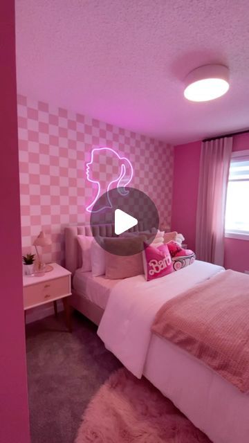 a bedroom with pink walls and checkered wallpaper