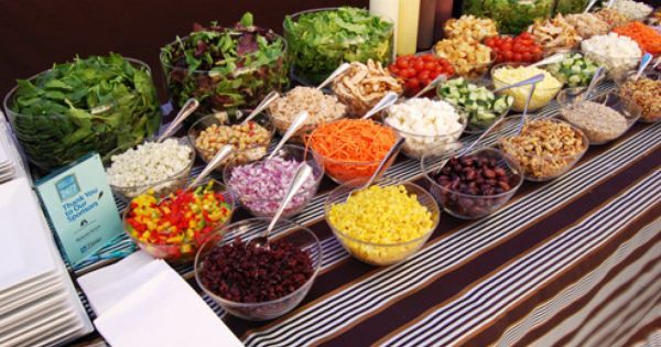 a buffet table filled with lots of different foods