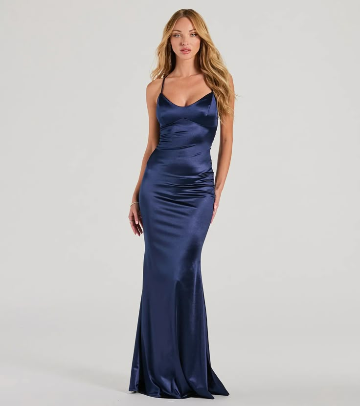 You're sure to sweep everyone off their feet in the Emmie satin formal dress for a simply dreamy look at banquets or weddings!  Made from high-quality satin-knit fabric, this dress exudes elegance and will make you stand out at any formal event. She boasts a flattering V-neckline and spaghetti straps, creating a feminine and elegant look. The lace-up back adds a touch of sophistication, while the mermaid silhouette and floor-length hem provide a glamorous finish. Complete the look with a grand n Blue Full Length Dress, Windsor Navy Blue Dress, Midnight Blue Silk Prom Dress, Navy Spaghetti Strap Dress, Navy Blue Cocktail Dress Classy, Satin Floor Length Dress, Kay Stratford Prom Dress, Long Dark Blue Dress Formal, Dark Blue Satin Bridesmaid Dresses