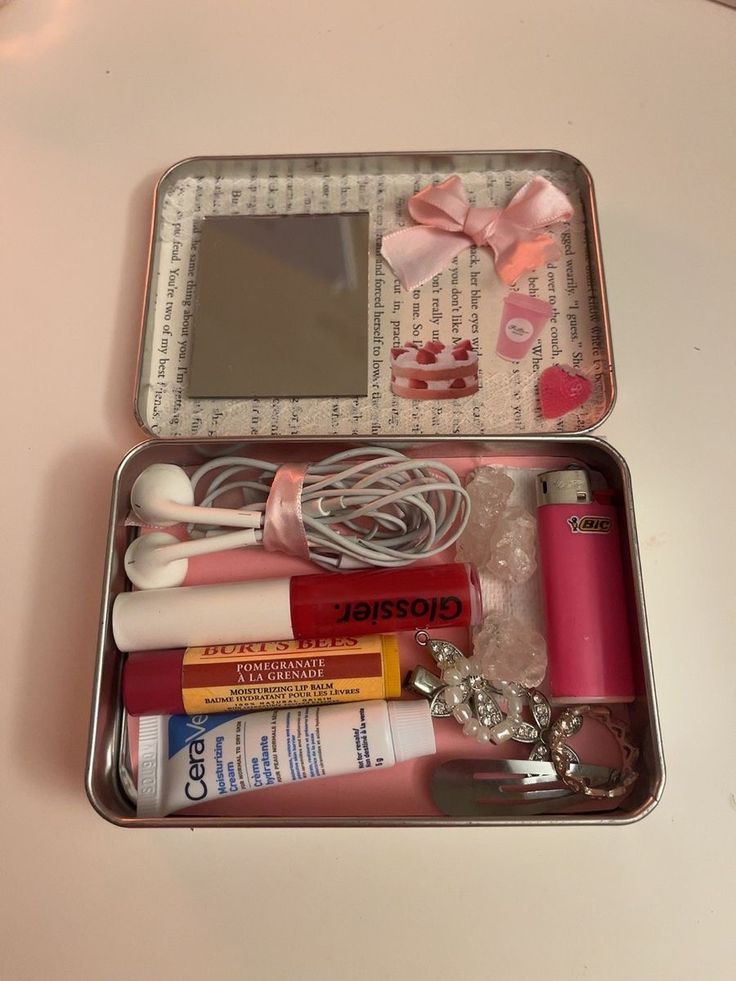 an open metal container with various items in it