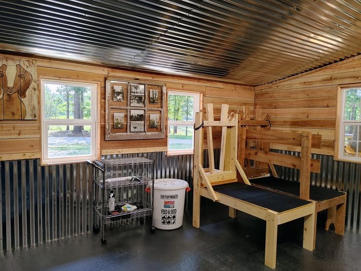 the inside of a wooden cabin with metal walls