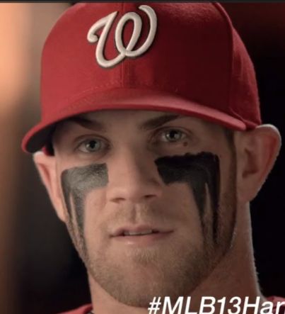 a man with his face painted to look like a washington nationals baseball team member is looking at the camera