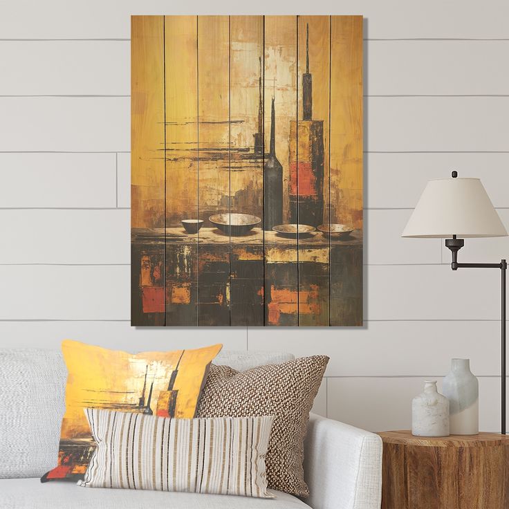 a living room scene with focus on the couch and painting hanging above it's head