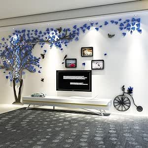 the living room is decorated in white and blue with an artistic tree on the wall