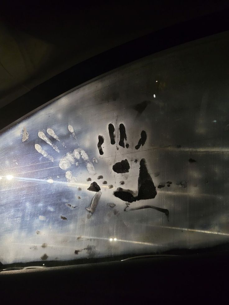 a hand print on the side of a vehicle