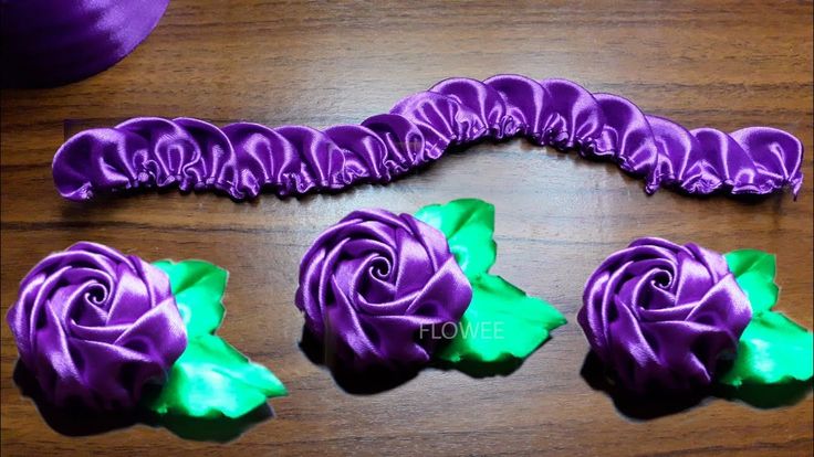 purple and green flowers on a wooden table