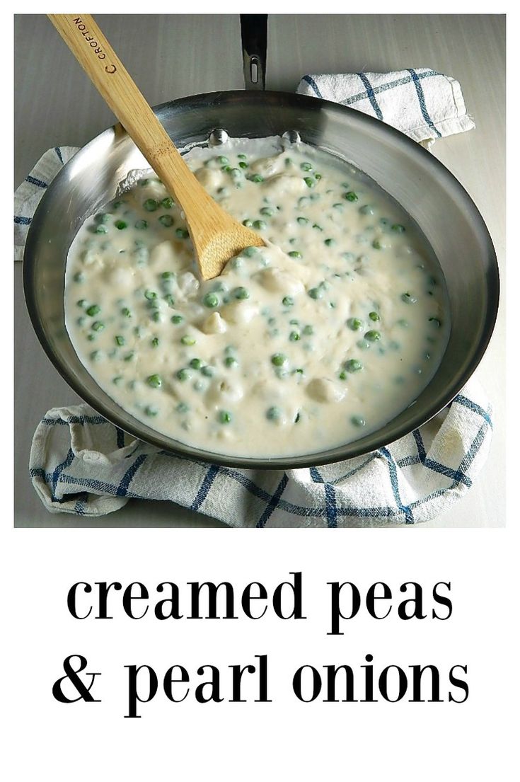 a skillet filled with creamed peas and pea onions