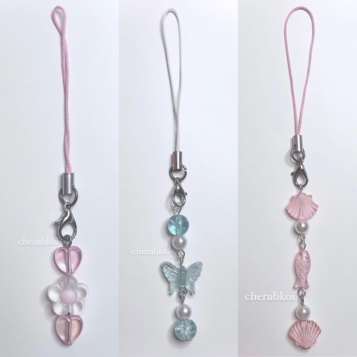 three different necklaces with beads and charms on them, one is pink the other is blue