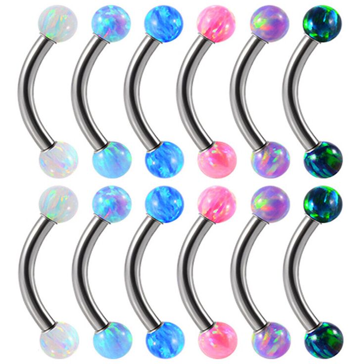 six different colored balls are attached to the metal barbells with black and white opals