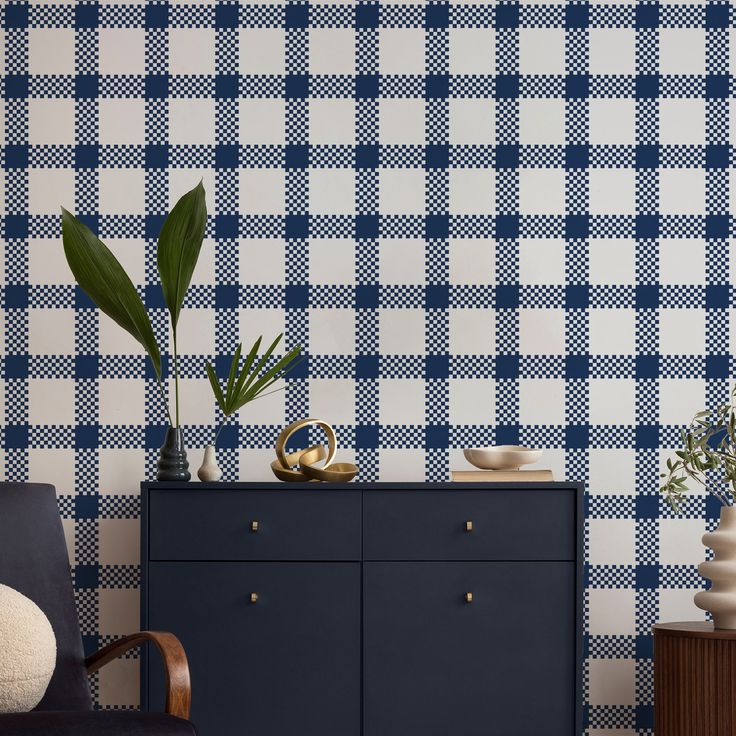 a blue and white checkered wallpaper in a living room