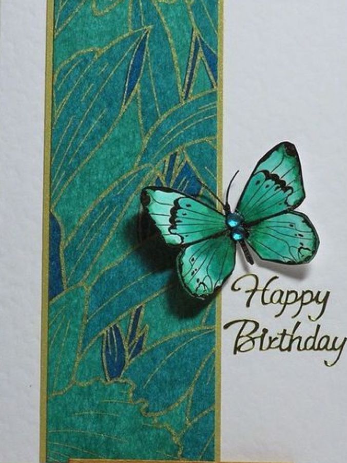 a card with a green butterfly on it