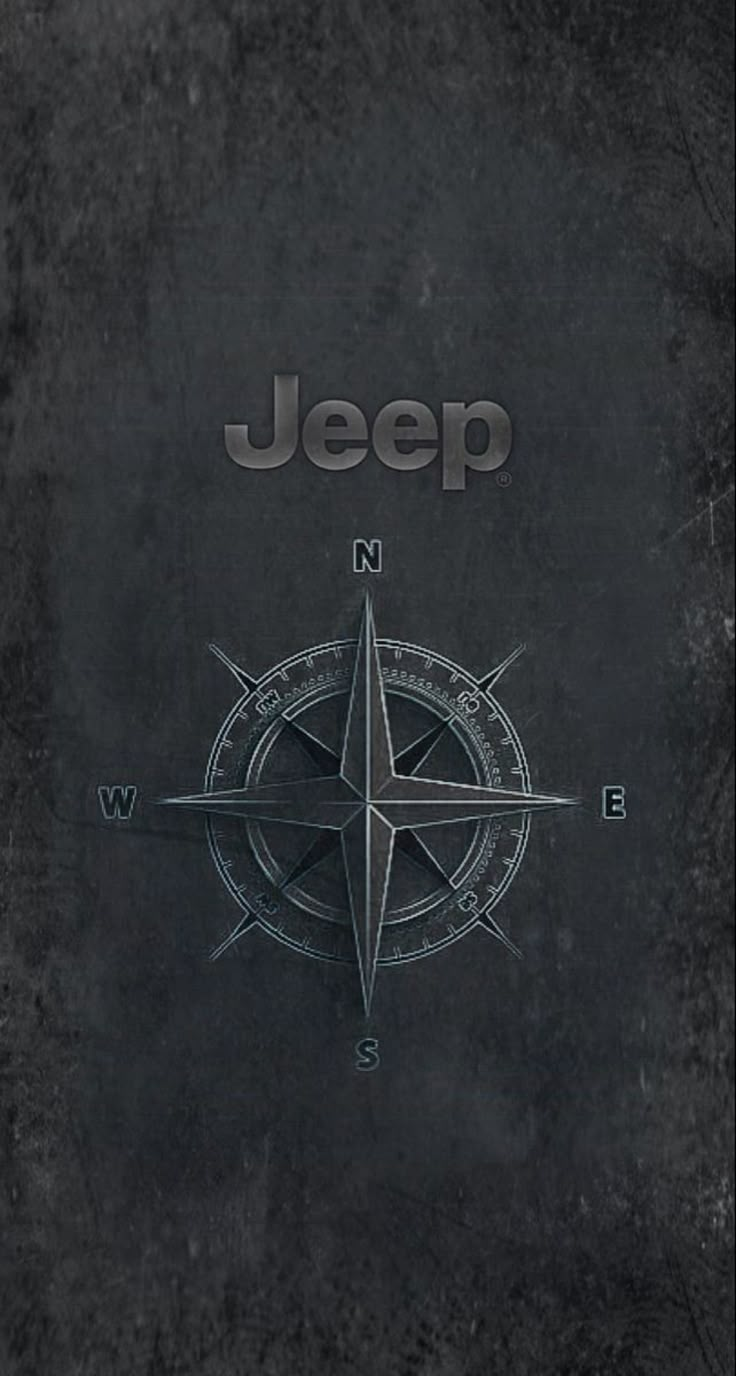 a black book cover with a compass and the word jeep written in silver on it