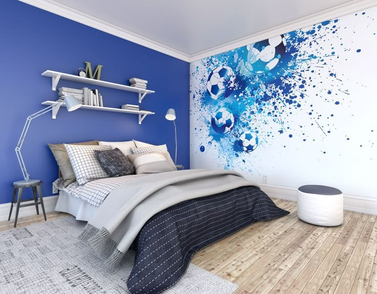 a bedroom with blue walls and wooden flooring is pictured in this image, there are shelves on either side of the bed