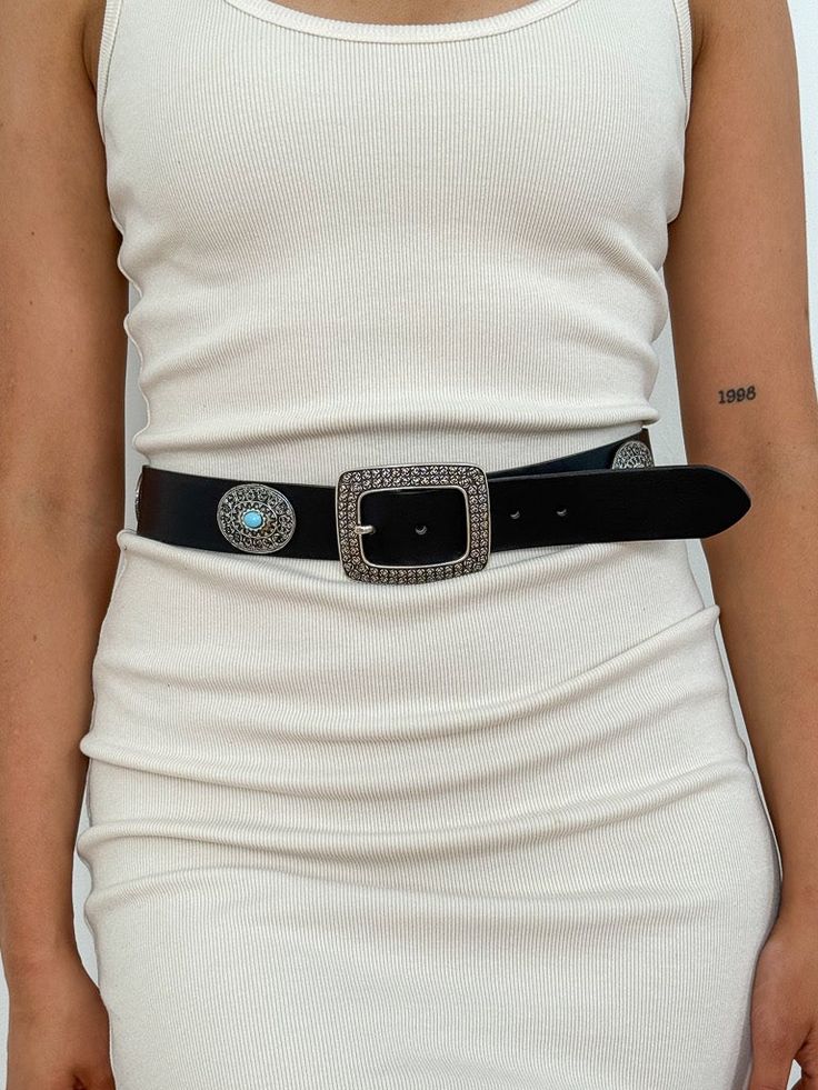 The Riverton Belt from Streets Ahead adds a vintage touch to your look with this western-inspired belt featuring black Italian leather, eye-catching silver and turquoise details and oversized square silver buckle. Strap Width: 1.5" Buckle Height: 2.75" - Length: 3.25" Genuine Italian Leather Ethically Made in California Black Media, Black Belt, Turquoise Stone, Italian Leather, Leather Straps, Austin, Buckle, California, Turquoise