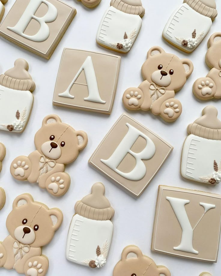 baby cookies with teddy bears and letters on them