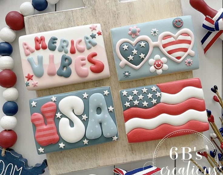 patriotic decorated cookies are displayed on a table