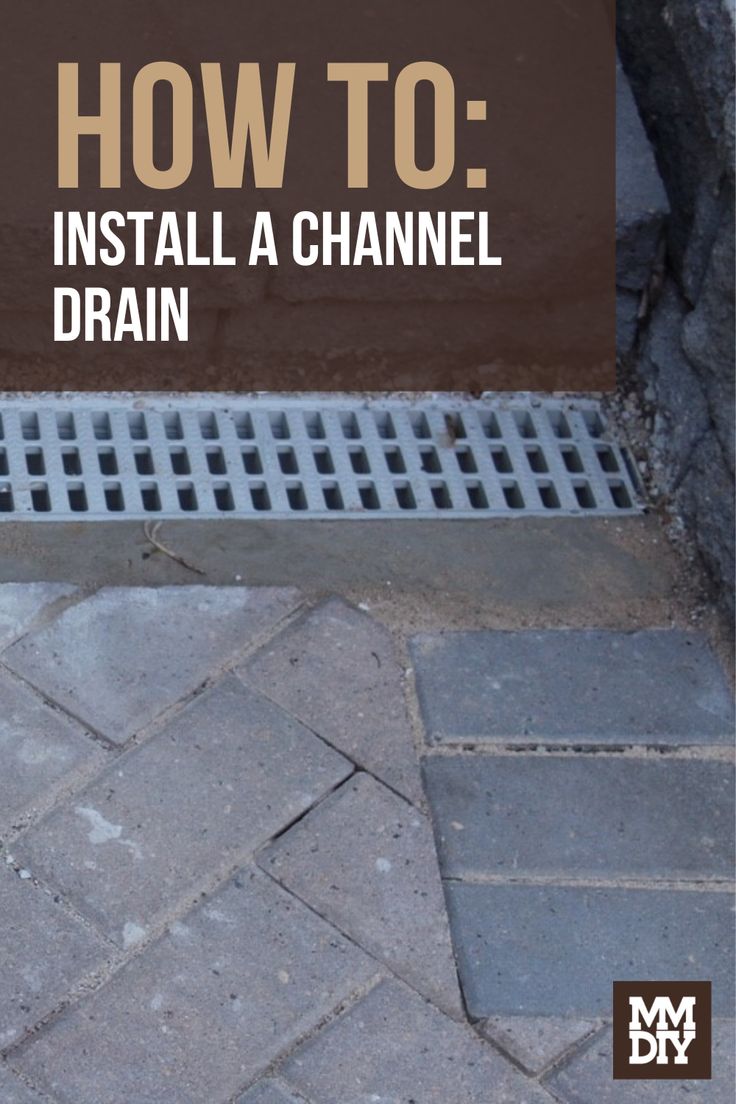 a drain in the ground with text overlaying how to install a channel drain