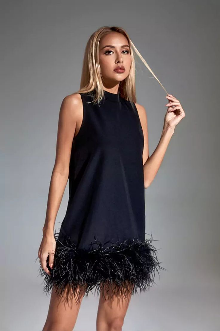 Add the adorable must-have Hope Black Feather Mini Dress! The sleeveless straight style design with a half-high collar adds a fashionable sense of luxury. The feathers are dotted under the dress, which looks fluffy and cute. Put on high heels or boots to create a unique look that belongs to you.  Dress Length: Approx 72cm Materials: 70% Polyester, 30% Cotton Gentle Dry Clean Only  Model is 5 ft 7 and wears size S  Colour may vary due to lighting on images. The product images (without model) are Feather Mini Dress, Blazer Mini Dress, Womens Trendy Dresses, Sequin Maxi Dress, Feather Dress, Black Feathers, Lovely Dresses, Floral Mini Dress, Long Sleeve Mini Dress