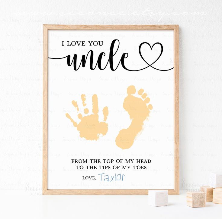 a framed print with the words i love you uncle and two hand prints