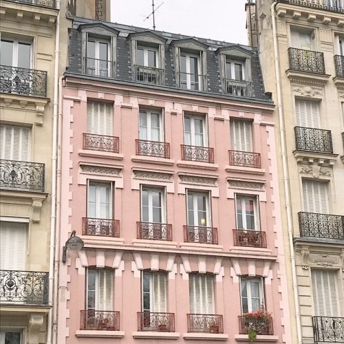 the building has many windows and balconies on it