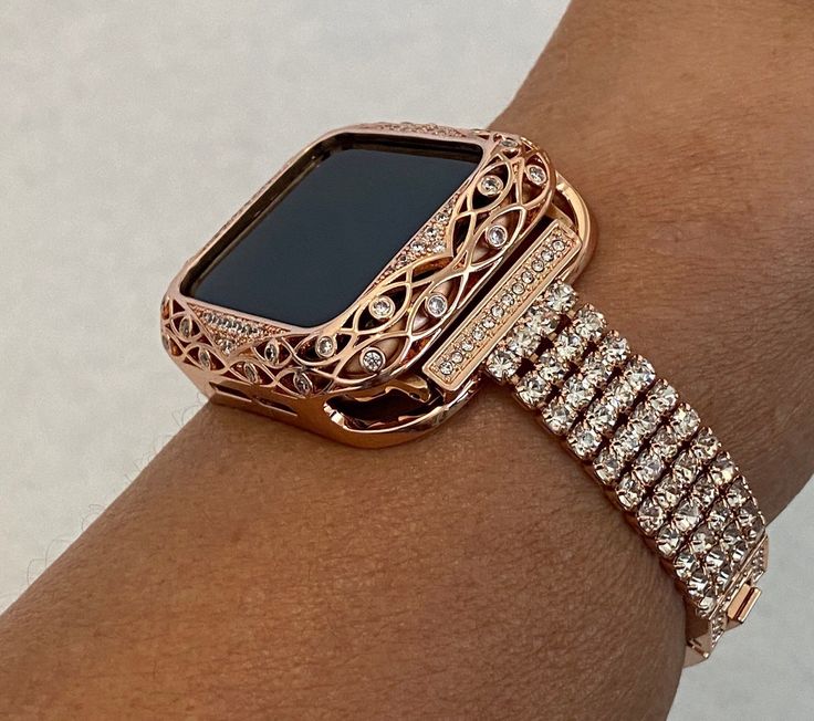 Fits the Apple Watch available for sizes 38mm 40mm 41mm 42mm 44mm 45mm Series 2-9 SE Men's & Women's.  This is a custom design made to fit the Apple Watch, it is not a brand copy. Luxury Silver Apple Watch Band Women Fashion Design.  Large Hand Set 3mm High End Swarovski Crystals set in a custom Zinc Plated Alloy Band for extra shine and durability. Wrist size fits 5.75 inch to 8 inch, changing size only click and unfold without link removal tool size fits 5.75 inch to 8 inch, changing size only Apple Watch Bands Rose Gold, Apple Watch Band Women, Apple Watch Bands Women, Ceramic Apple, Rose Gold Apple Watch, Bezel Jewelry, Gold Apple Watch, Iphone Watch, Bracelet Apple Watch