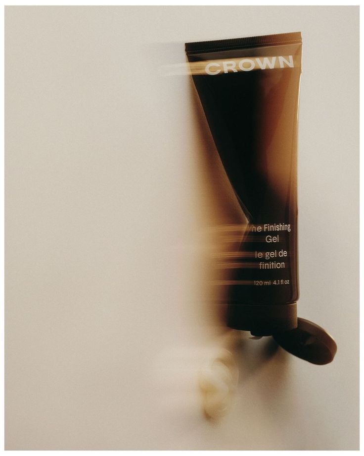 a tube of brown tinted gel sitting on top of a table