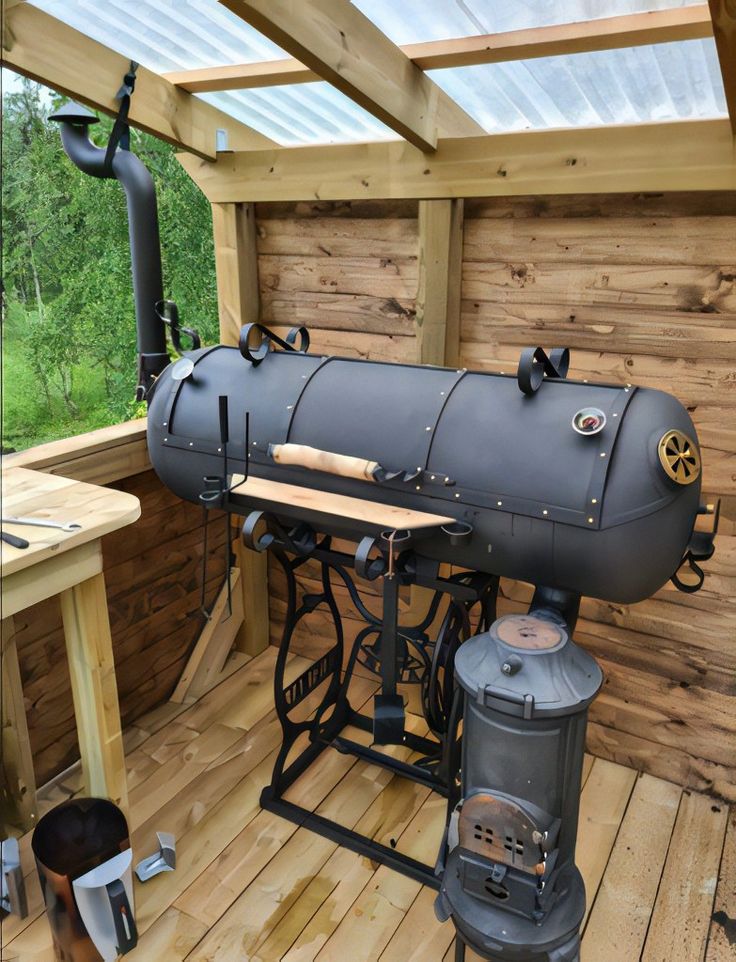 an old fashioned steam engine sitting on top of a wooden floor