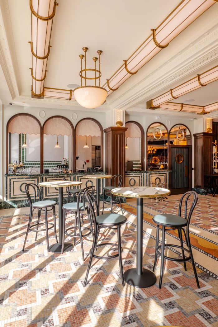 the inside of a restaurant with tables and chairs