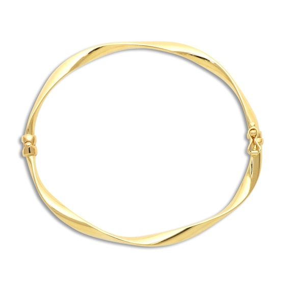 High-polish ribbons twist elegantly around this incredible women's bangle bracelet. 14K Yellow Gold Secures with a tongue clasp. From the Italia D'Oro Collection. Exclusively available from Jared® the Galleria of Jewelry. Yellow Gold Bangle Bracelet With Spring Ring Clasp, Formal Bangle Bracelet With A Modern Twist, Formal Bangle With Modern Twist, Formal Yellow Gold Hoop Cuff Bracelet, Formal Flexible Yellow Gold Cuff Bracelet, Elegant Bangle With Gold Clasp, Gold Bracelets With Polished Finish And Modern Twist, Modern Twist Gold Bracelets With Polished Finish, Hoop Bracelets With Polished Finish For Formal Occasions