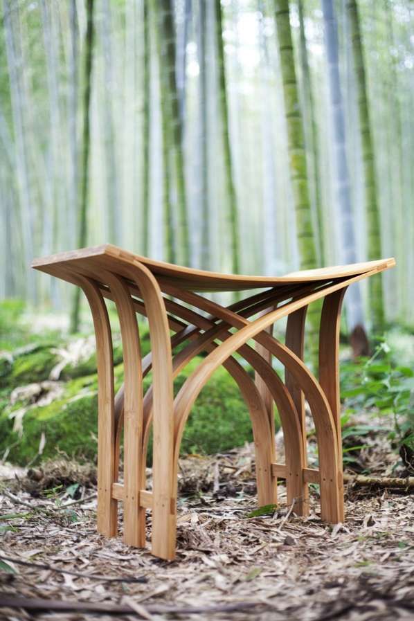 a wooden bench sitting in the middle of a forest