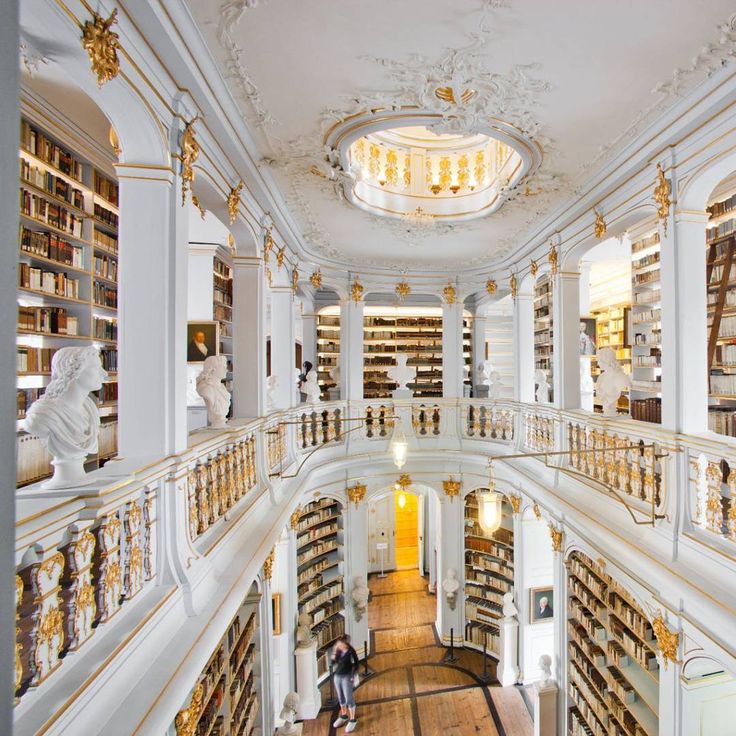 the interior of a library with many bookshelves