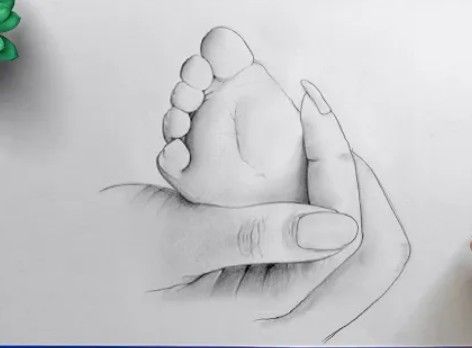 a drawing of a hand holding a baby's foot