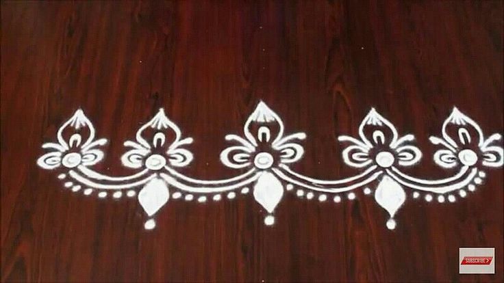 an intricately decorated wooden surface with white paint