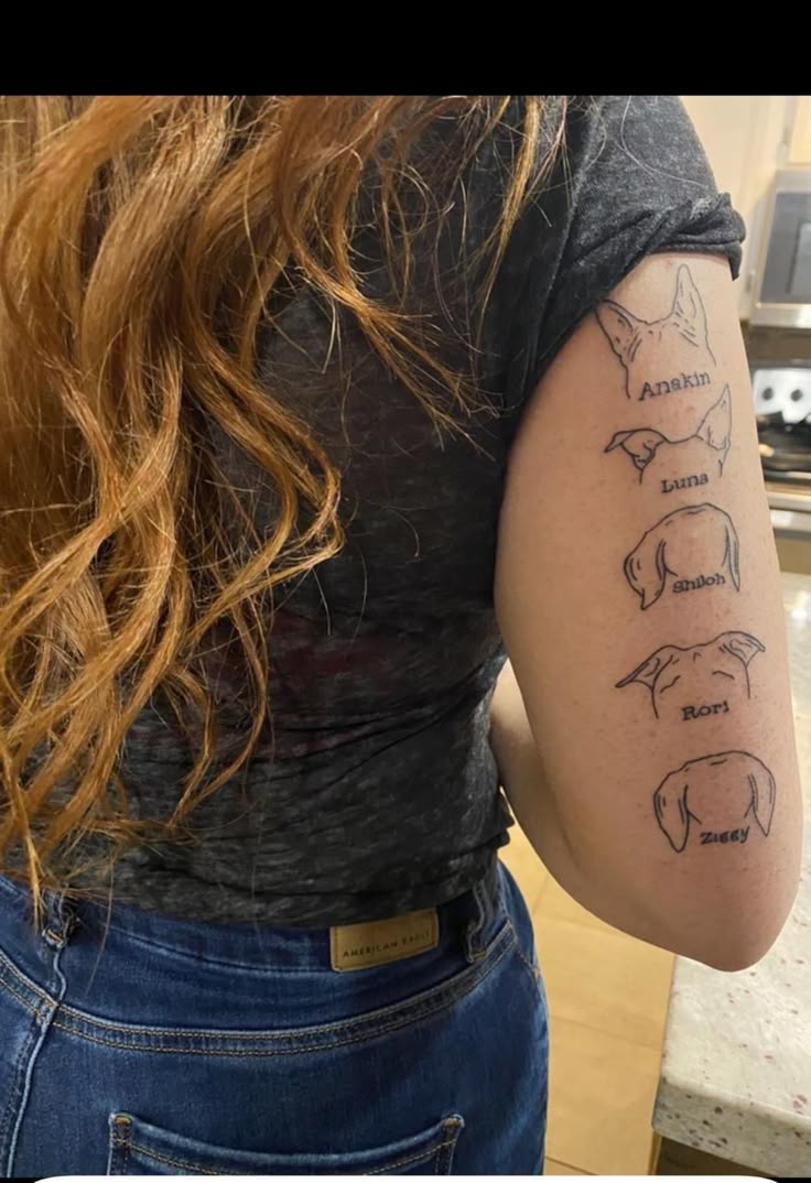 the back of a woman's shoulder with writing on it