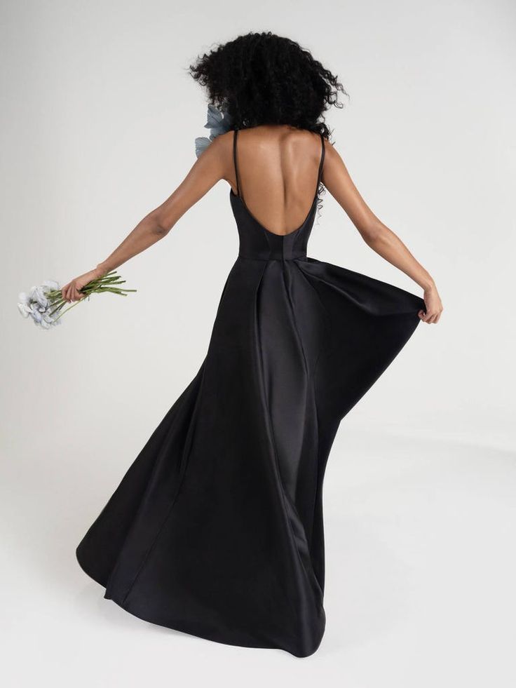 the back of a woman in a black dress