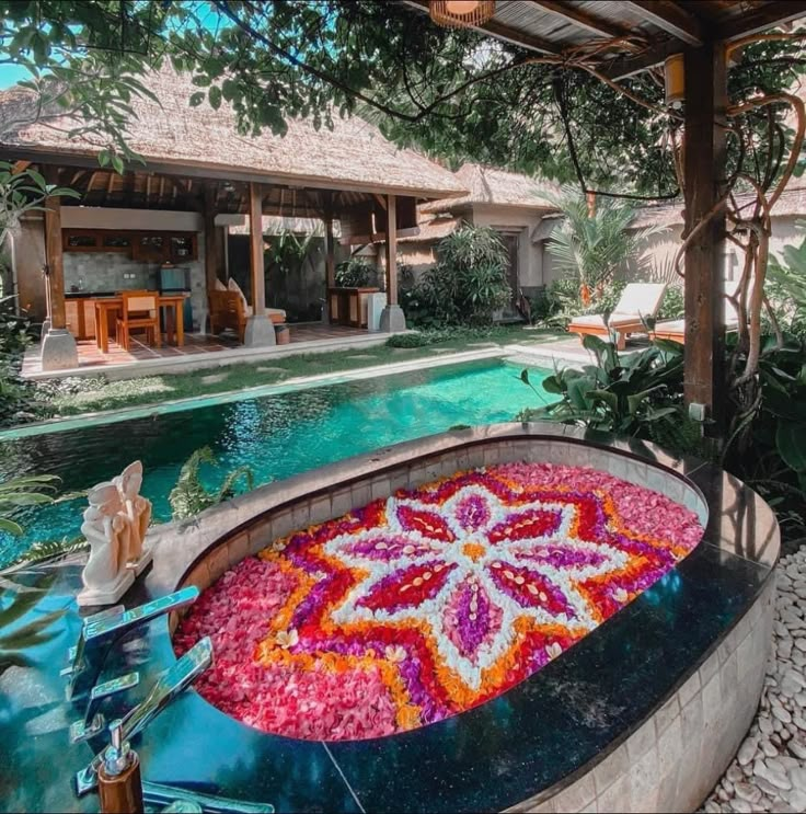 an outdoor swimming pool with flowers on it