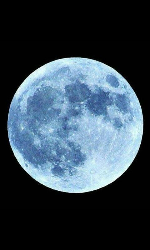 the full blue moon is seen in the sky with no clouds on it's side