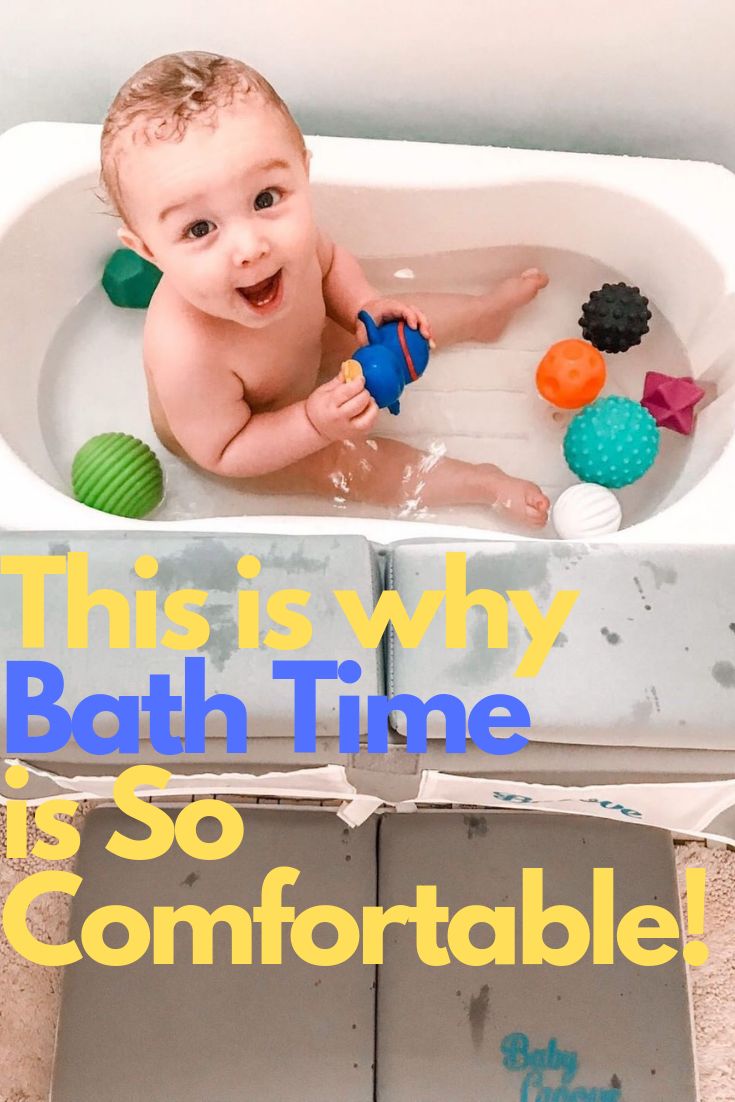 a baby sitting in a bath tub with toys on the floor and text that reads, this is why bath time is so comfortable