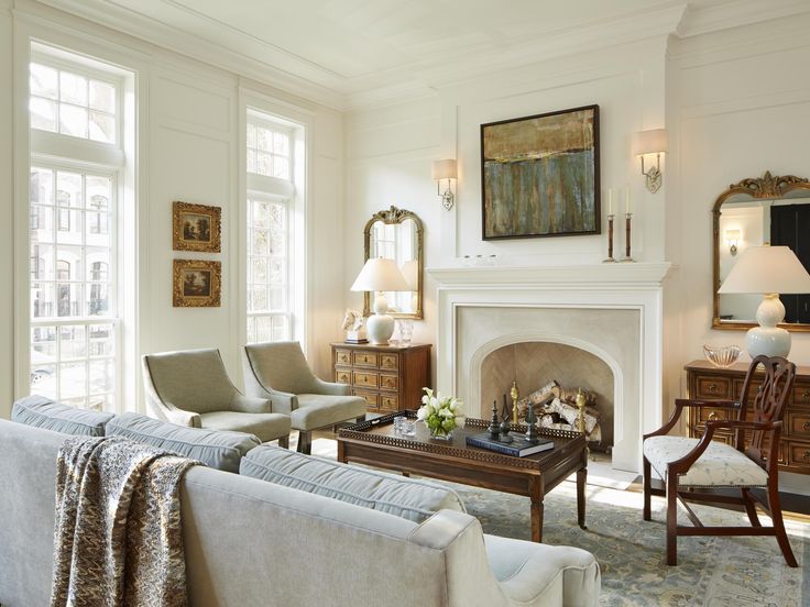 a living room filled with furniture and a fire place