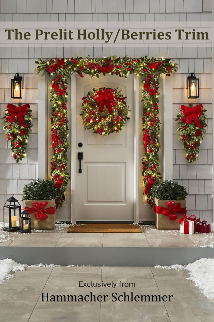 a white door with christmas wreaths and lights on it