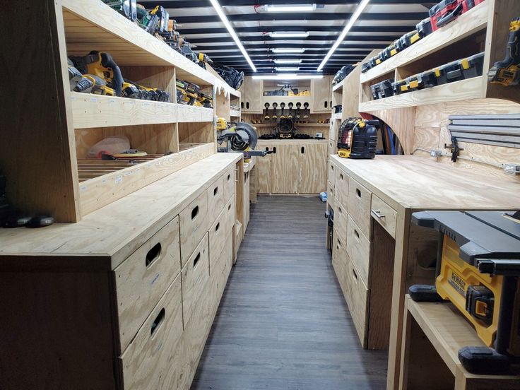 a room filled with lots of wooden shelves and tools on top of each shelf,