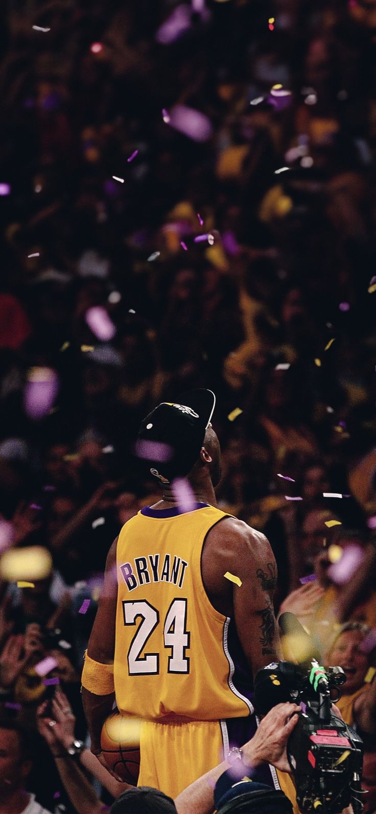 a man in a yellow jersey is surrounded by confetti