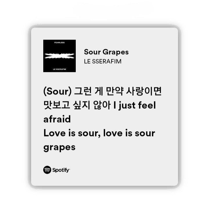 a white square sign with black writing on the front and back of it that says sour grapes le sefram