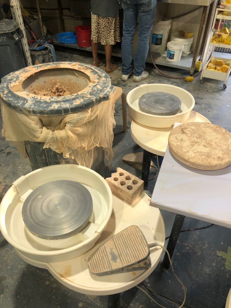 several different types of pottery sitting on top of tables