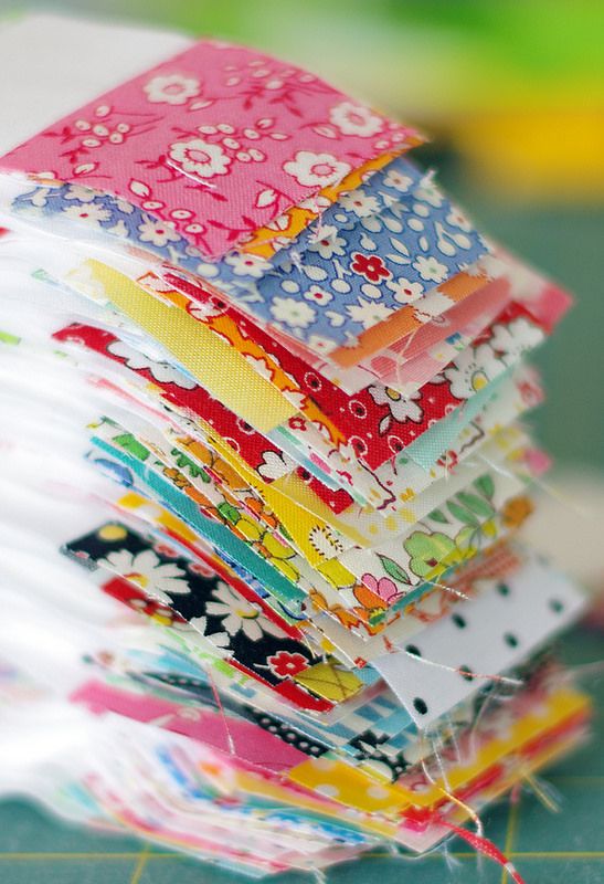 a stack of colorful papers sitting on top of a table